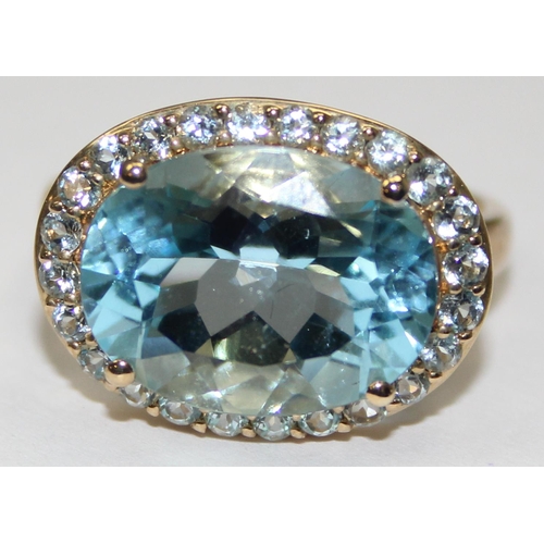 2087 - A 9ct gold antique style light blue stone cocktail ring surrounded by small white stones, full Engli... 