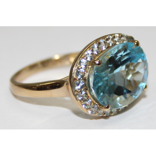 2087 - A 9ct gold antique style light blue stone cocktail ring surrounded by small white stones, full Engli... 