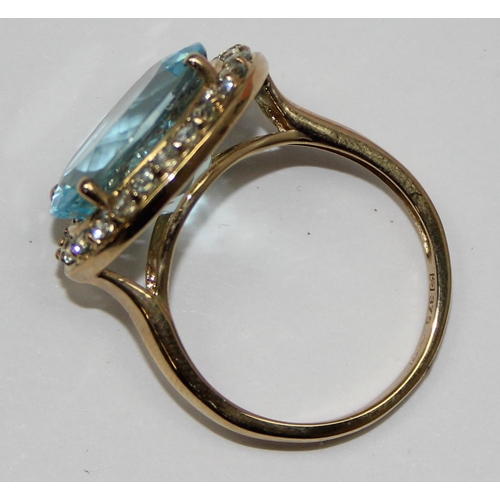 2087 - A 9ct gold antique style light blue stone cocktail ring surrounded by small white stones, full Engli... 