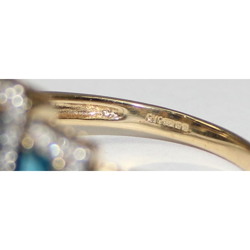 2089 - A 9ct gold Art Deco style trilogy blue stone cocktail ring surrounded by small diamonds, full Englis... 