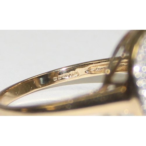 2090 - A 9ct gold antique style blue stone cocktail ring surrounded by small diamonds, full English hallmar... 