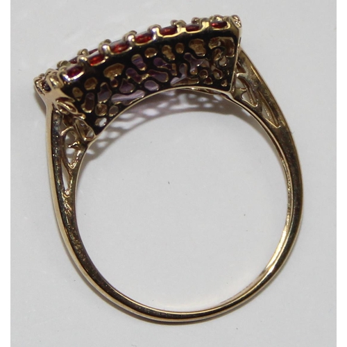 2093 - A 9ct gold Georgian style ring in decorative mounting, a large facet cut light purple stone surround... 