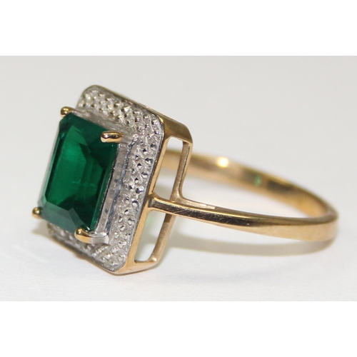 2107 - A 9ct gold Art Deco style greenstone ring surrounded by pave diamonds, full English hallmarks, appro... 