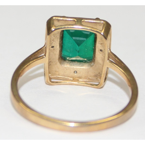 2107 - A 9ct gold Art Deco style greenstone ring surrounded by pave diamonds, full English hallmarks, appro... 