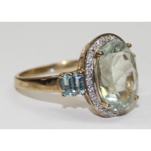 2108 - A 9ct gold antique style white stone ring surrounded by small diamonds and baguette cut white stones... 