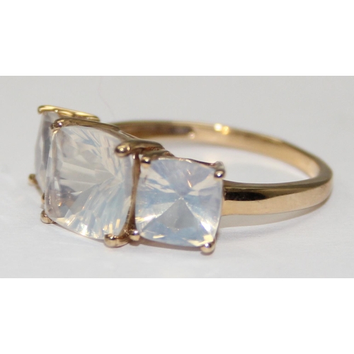 2112 - A 9ct gold trilogy ring comprising of 3 cloudy white stones, full English hallmarks, approx size U, ... 