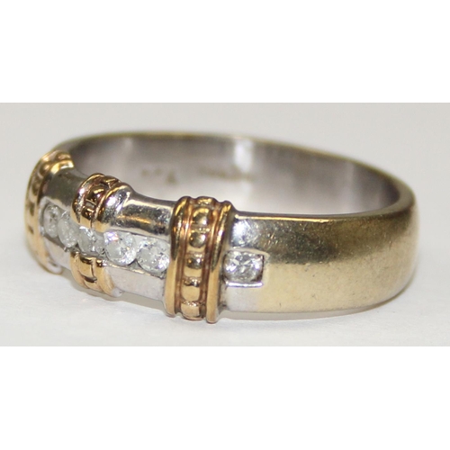 2122 - A 9ct gold retro style band ring set with 7 diamonds in a strap setting, full English hallmarks, app... 