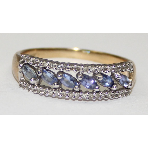 2123 - A 9ct gold ring set with light blue or purple stones surrounded by small diamonds, full English hall... 