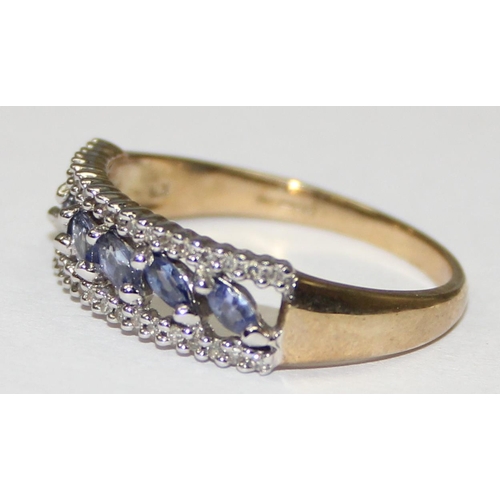 2123 - A 9ct gold ring set with light blue or purple stones surrounded by small diamonds, full English hall... 