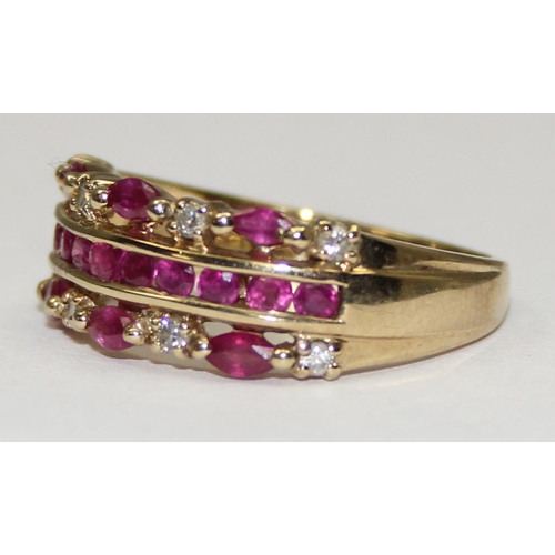 2127 - A 9ct gold retro style ring set with lines of rubies and small diamonds, full English hallmarks, app... 