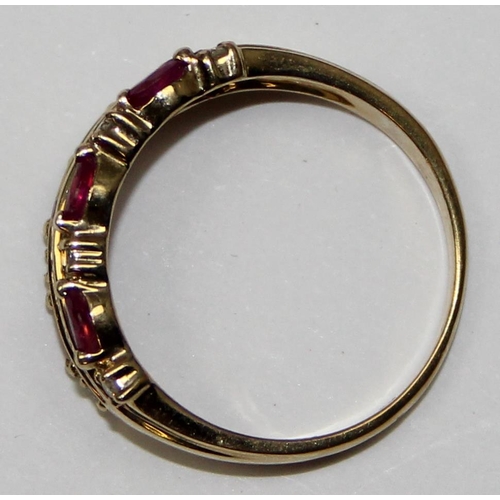 2127 - A 9ct gold retro style ring set with lines of rubies and small diamonds, full English hallmarks, app... 