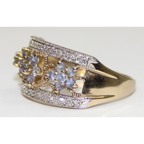 2128 - A 9ct gold ring set with floral formed small purple stones and small diamonds, full English hallmark... 