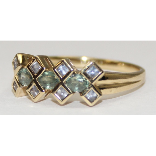 2129 - A 9ct gold retro style ring set with light green and white stones in an angular setting, full Englis... 