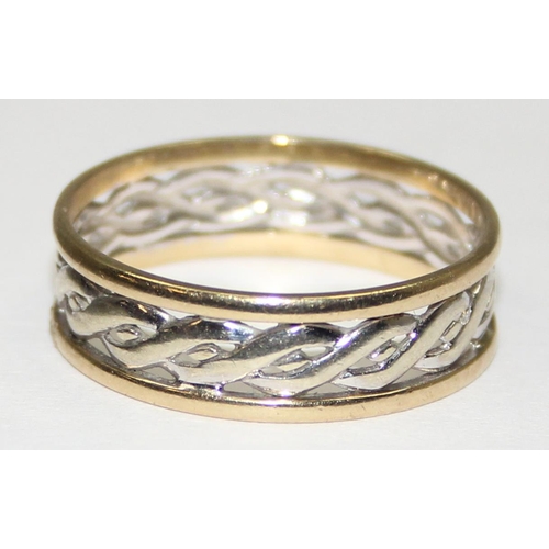 2132 - A 9ct white and yellow gold Celtic style band ring, full English hallmarks, approx size Y, approx 3.... 