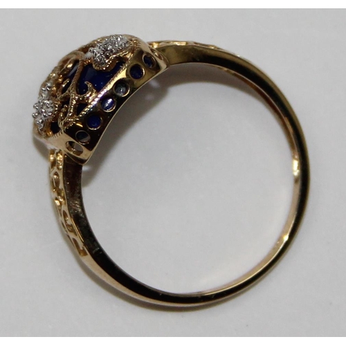 2134 - An unusual 9ct gold antique style dress ring, a large central cabochon of Lapis overlaid with small ... 