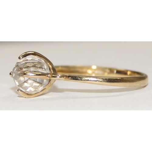 2140 - An unusual 9ct gold ring with a facet cut white crystal orb in claw setting, full English hallmarks,... 