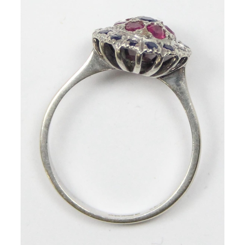 2144 - An 18ct white gold sapphire and ruby cluster ring, full hallmarks, approx size O, approx 3.31g gross