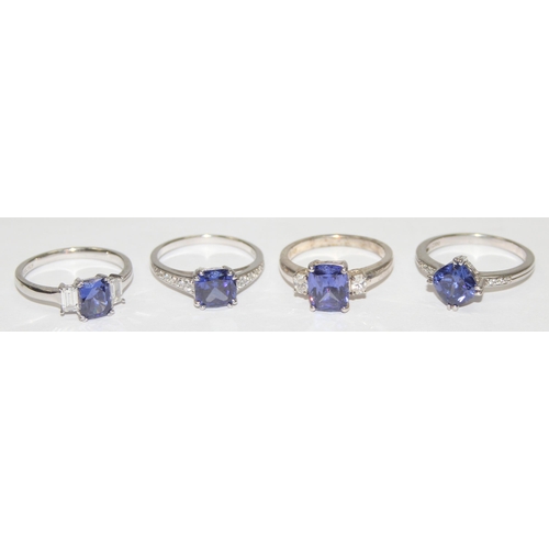 2230 - 4 assorted 925 silver dress rings, mainly with blue and white stones in various designs, mixed sizes... 