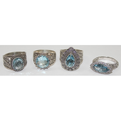 2234 - 4 assorted 925 silver dress rings, mainly with blue stones and filigree mounts in various designs, m... 