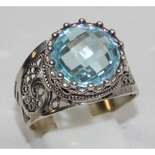 2234 - 4 assorted 925 silver dress rings, mainly with blue stones and filigree mounts in various designs, m... 