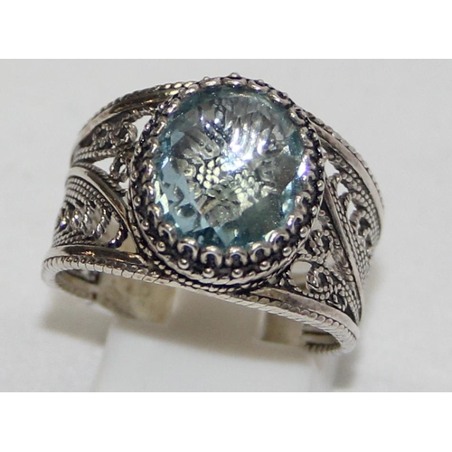 2234 - 4 assorted 925 silver dress rings, mainly with blue stones and filigree mounts in various designs, m... 