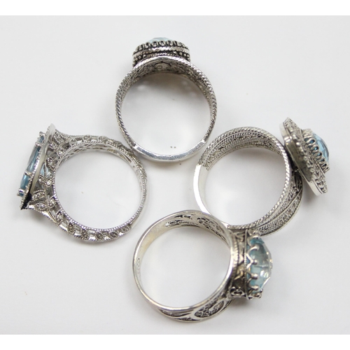 2234 - 4 assorted 925 silver dress rings, mainly with blue stones and filigree mounts in various designs, m... 