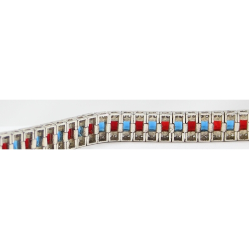 2273 - An Art Deco style 925 silver tennis bracelet, an alternating row of red and blue stones flanked on e... 