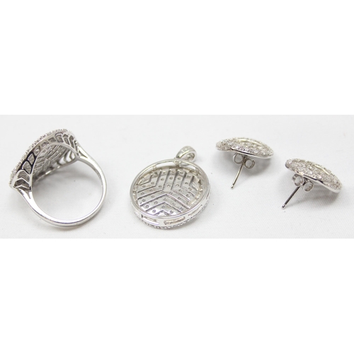 2283 - A 925 silver and white stone ring, pendant and matching earring set, all marked 925 and XRF confirme... 