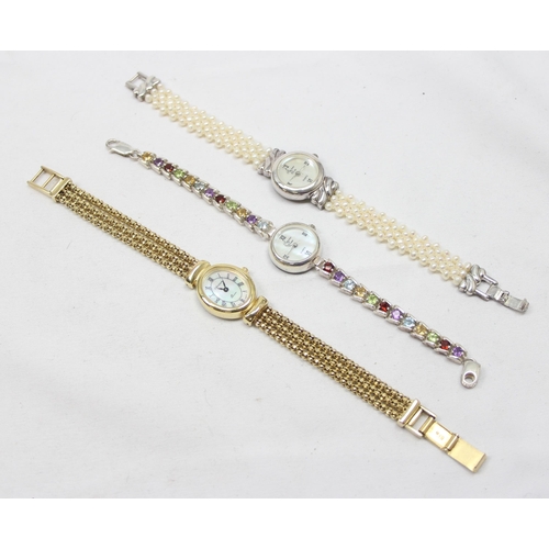 1311 - 3 ladies watches all marked 925 silver, one with faux pearl strap, one silver-gilt and one with colo... 