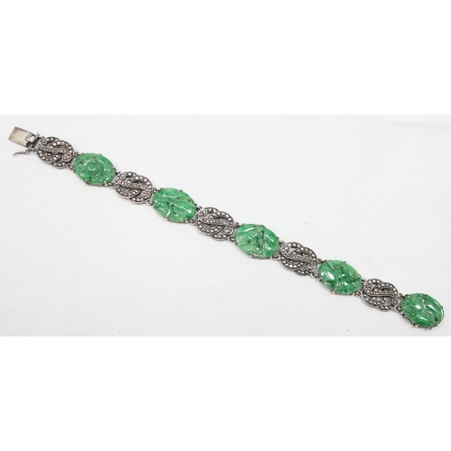 2020 - A stunning early 20th century Art Deco period silver marcasite and carved jade bracelet, seemingly u... 