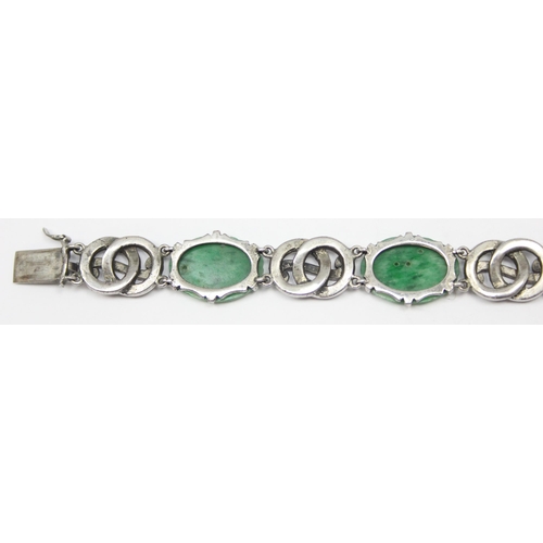 2020 - A stunning early 20th century Art Deco period silver marcasite and carved jade bracelet, seemingly u... 