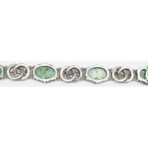 2020 - A stunning early 20th century Art Deco period silver marcasite and carved jade bracelet, seemingly u... 