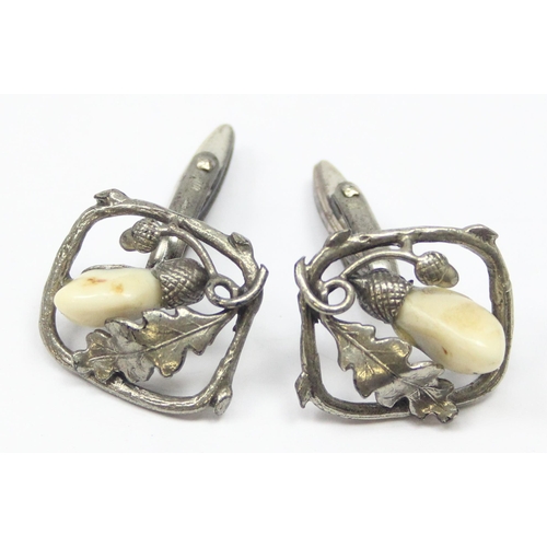 2022 - A pair of silver and hardstone cufflinks formed as acorns and oak leaves and a silver oak leaf brooc... 