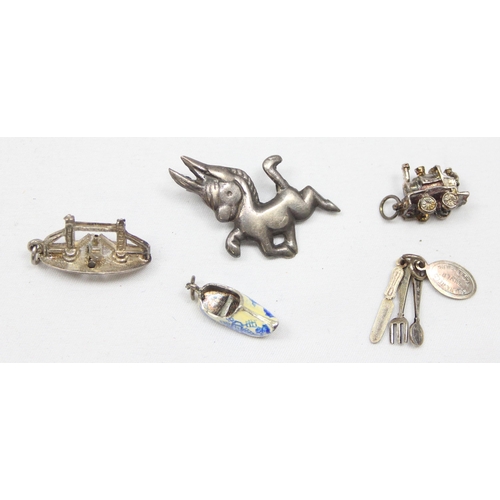 2026 - A small vintage silver brooch formed as a cartoon donkey, a silver charm formed as Tower Bridge in L... 