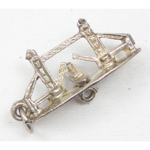 2026 - A small vintage silver brooch formed as a cartoon donkey, a silver charm formed as Tower Bridge in L... 