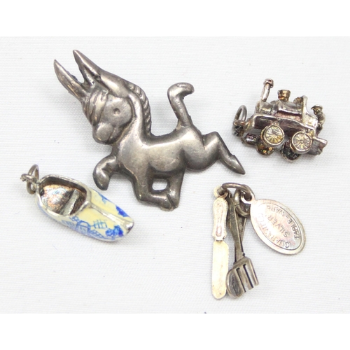 2026 - A small vintage silver brooch formed as a cartoon donkey, a silver charm formed as Tower Bridge in L... 