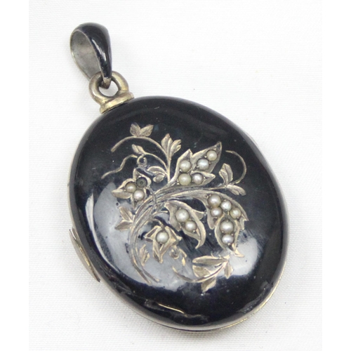 2033 - A Victorian black enamel and seed pearl on silver mourning locket, indistinctly marked to loop but X... 