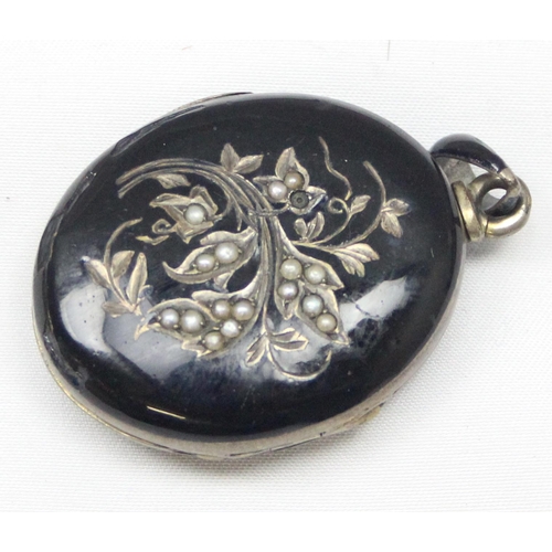 2033 - A Victorian black enamel and seed pearl on silver mourning locket, indistinctly marked to loop but X... 