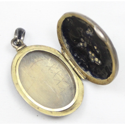 2033 - A Victorian black enamel and seed pearl on silver mourning locket, indistinctly marked to loop but X... 