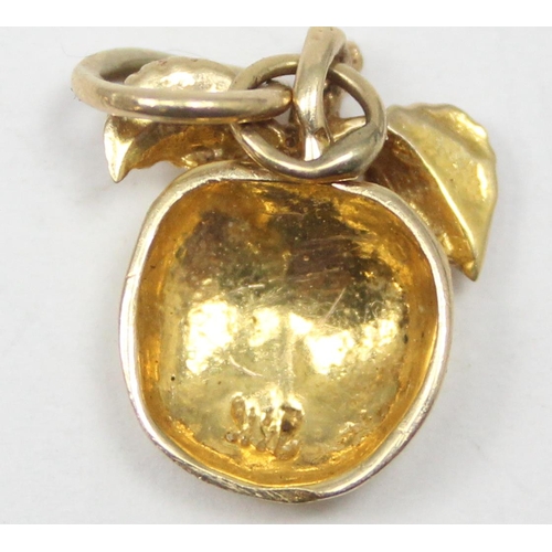 2343 - A 14ct gold pendant or charm formed as an apple, marked 14k and XRF confirmed, approx 1.88g gross