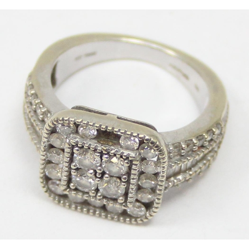 2344 - A 10ct white gold dress ring set with diamonds in a retro style setting, marked 10k and XRF confirme... 