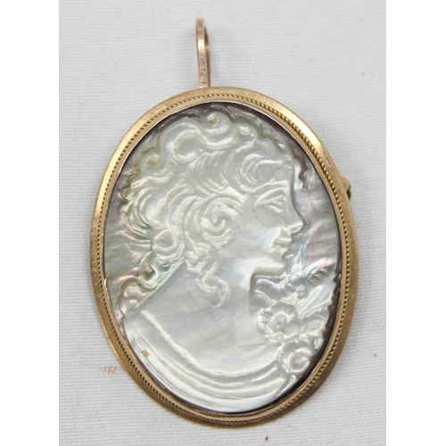 2347 - A 9ct gold mounted mother of pearl carved cameo pendant or brooch, marked 375 and XRF confirmed, app... 