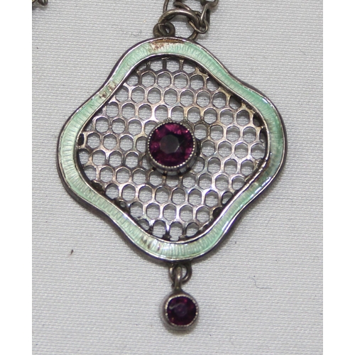 2373 - An early 20th century silver and enamel pendant in the suffragette colours, a ribbon of light green ... 