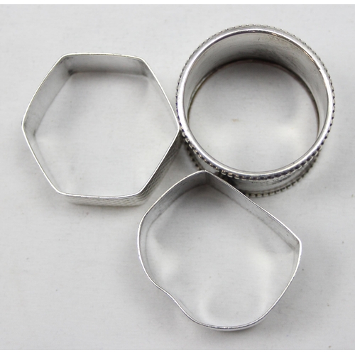 1020 - 3 assorted silver napkin rings, all with English hallmarks, various dates and makers, approx 62.11g ... 