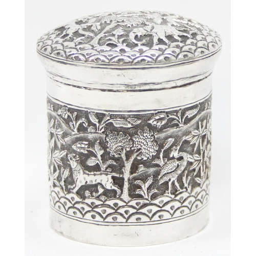 1040 - An Indian silver lidded pot with embossed decoration of animals in a jungle setting, unmarked but XR... 