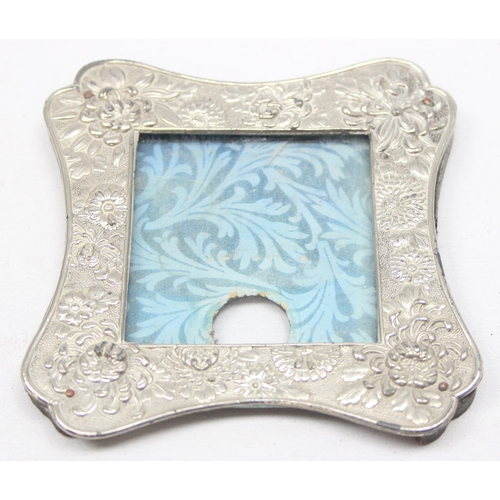 1041 - 2 vintage Japanese silver plated photograph frames decorated with Chrysanthemums, the largest approx... 