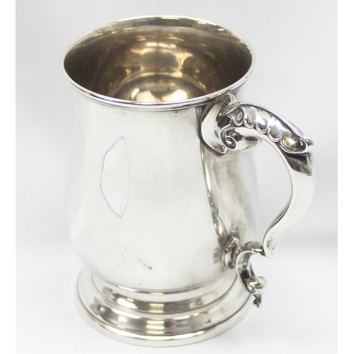 1042 - A solid silver pint tankard, Sheffield 1949 by Poston Products Limited, engraved dedication from Nes... 