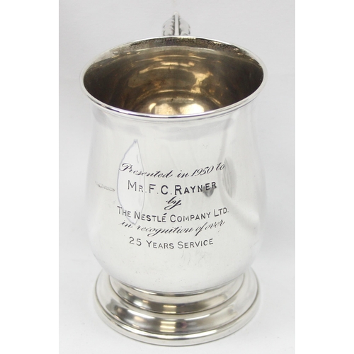 1042 - A solid silver pint tankard, Sheffield 1949 by Poston Products Limited, engraved dedication from Nes... 