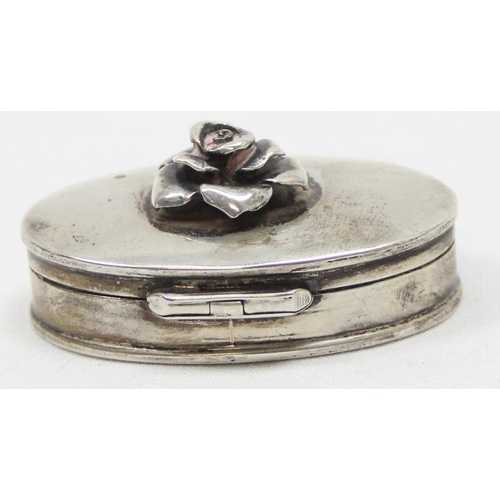 1049 - A small 925 silver pill box with rose finial, marked to base with import marks for Sheffield 1997, a... 