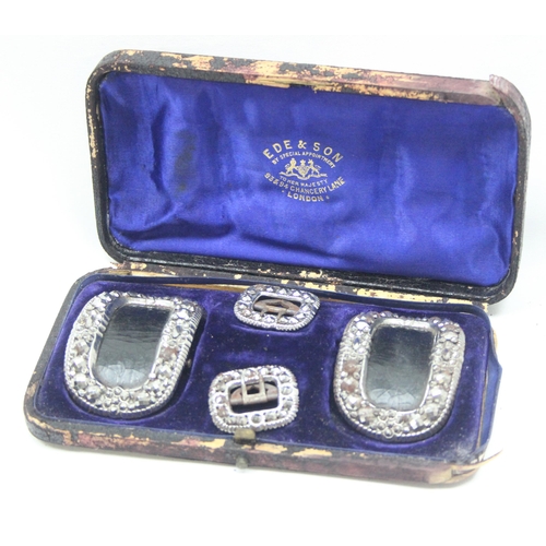 1057 - A boxed set of 4 19th century leather and bright cut steel shoe buckles, box marked for Ede & Son of... 